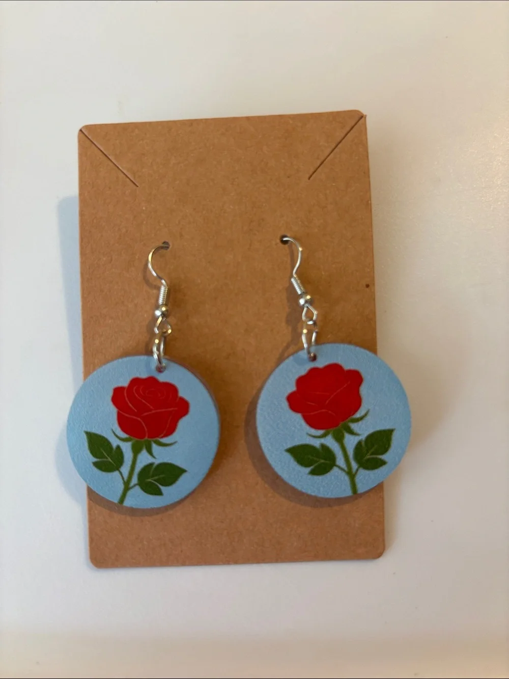 Fashion Jewelry Red Rose Earrings on Light Blue Discs